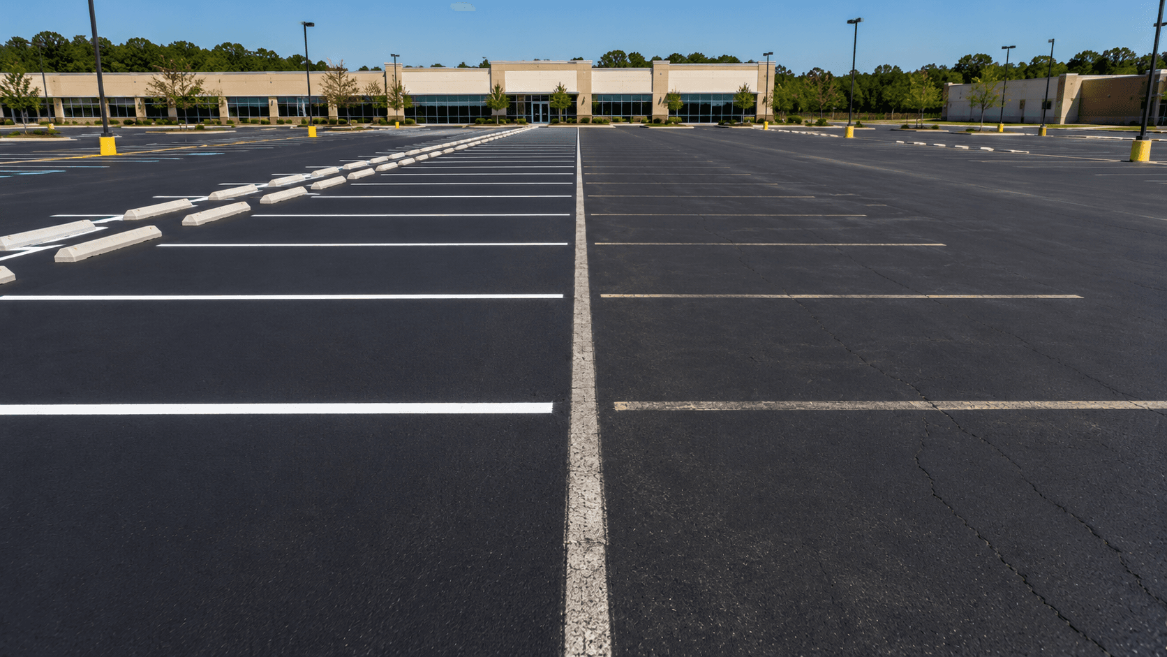 Side-by-side comparison of thermoplastic and painted parking lot stall lines