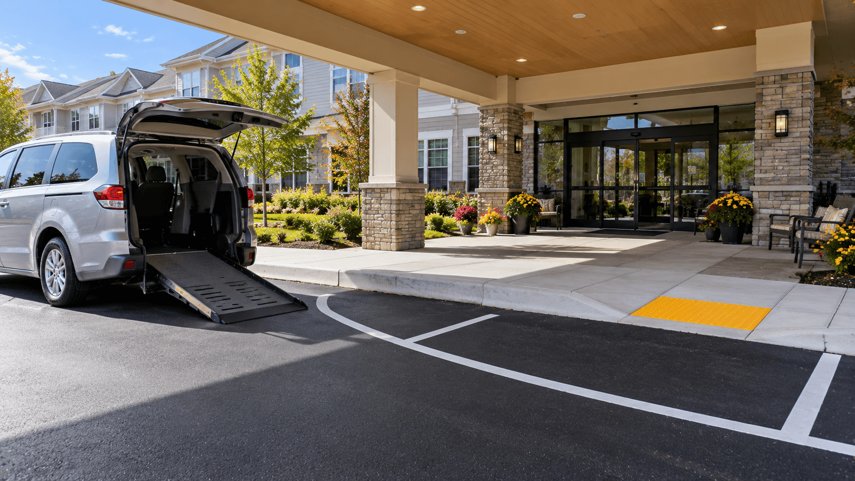 Wheelchair-accessible drop-off area at a senior living facility entrance